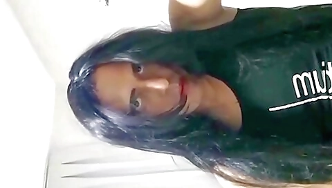 A blonde in her lingerie and stockings masturbates in bed