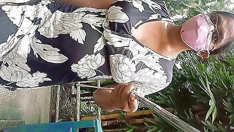 Hot amateur girl walking around the park in the sun