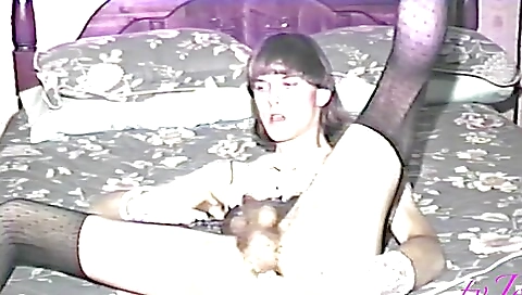 Amateur brunette shows hairy pussy on bed in stockings