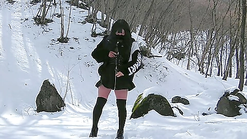 Amateur asian brunette gives a handjob out in snow