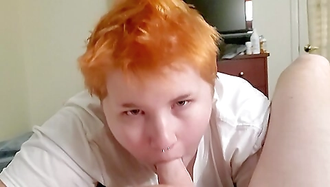 Red-haired tattooed babe with a tight booty gives a blowjob